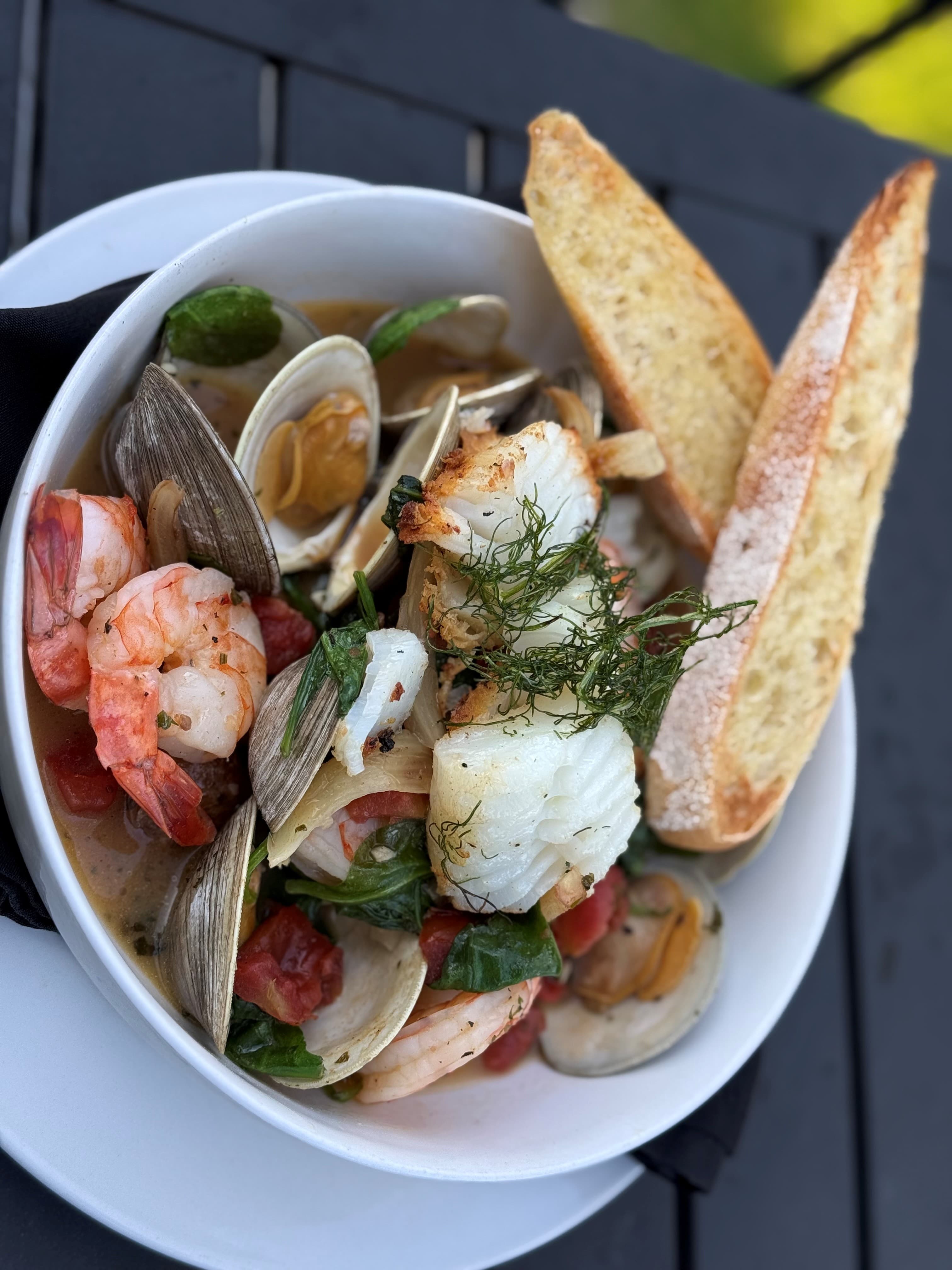 Cioppino — shrimp, cod and clams stewed in a fennel and tomato broth over roasted fingerlings at The Mansard Inn